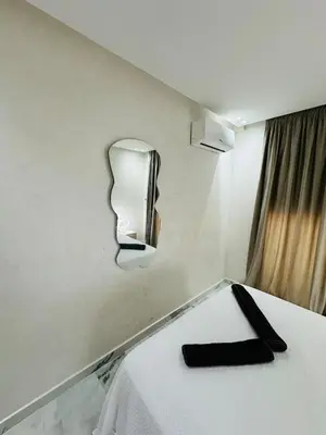 a hotel room with a bed with a black napkin on it at Studio lumineux pour un séjour agréable 28 in Casablanca
