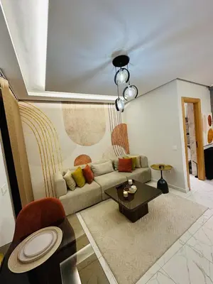 a living room with a couch and a table at Studio moderne et accueillant, pour se reposer 14 in Casablanca
