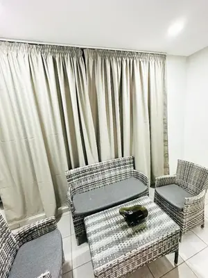 a living room with a couch and two chairs at Studio cosy et calme, idéal pour se détendre 15 in Casablanca