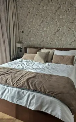 a bedroom with a large bed with pillows at Appartement CFC - Anfasky in Casablanca