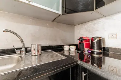 a kitchen with a sink and a counter top at Apartment in the center of Casablanca opposite the tram in Casablanca
