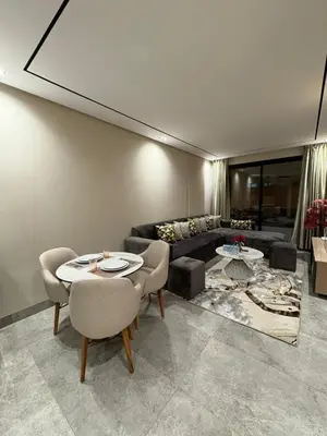 a living room with a couch and a table and chairs at Beau Living Residence Central Cosy Apartment In The Heart Of Casablanca Close To Anfa Park Calm Area in Casablanca