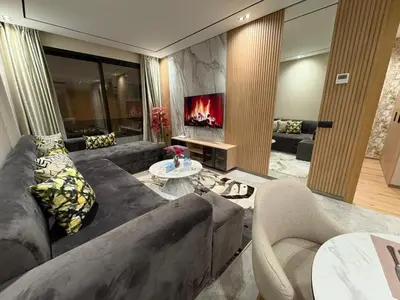 a living room with a couch and a fireplace at Beau Living Residence Central Cosy Apartment In The Heart Of Casablanca Close To Anfa Park Calm Area in Casablanca