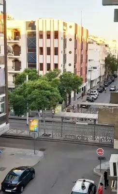 a view of a city street with cars parked at Superbe studio a avenue france agdal in Rabat