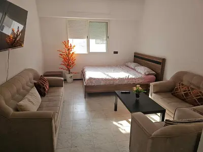 a living room with a bed and two couches at Superbe studio a avenue france agdal in Rabat