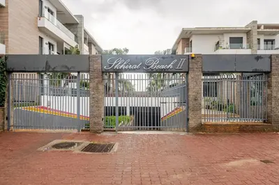 a wrought iron gate in front of a building at Cosy 2 Bedrooms Skhirat Residence in Skhirat