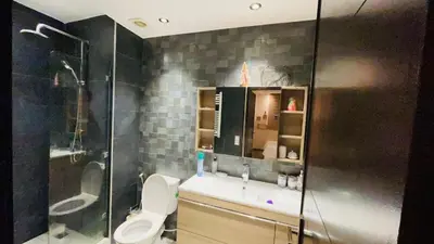 a bathroom with a toilet and a shower at Bright and cozy studio in Tamaris Beach in Tamaris