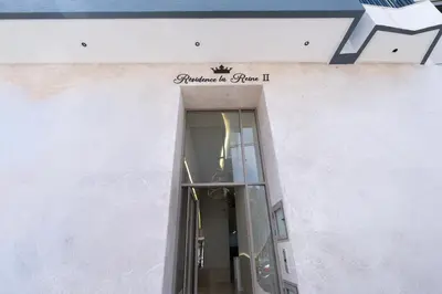 a doorway to a building with a sign on it at Maarif Premium 2 Bedrooms 2 Bathrooms La Reine II in Casablanca