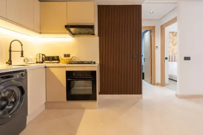 a kitchen with a sink and a dishwasher at Maarif Premium 2 Bedrooms 2 Bathrooms La Reine II in Casablanca