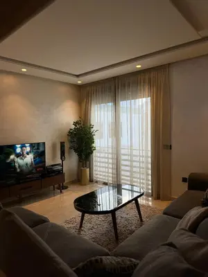 a living room with a couch and a coffee table at Séjour Premium Casablanca in LʼOasis