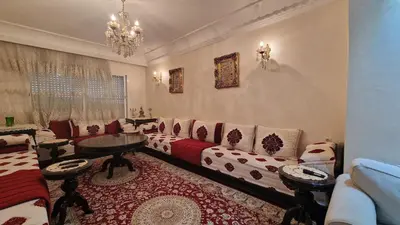 a living room with a couch and a table at 3BR Authentic Apartment in the heart of Casablanca in Casablanca