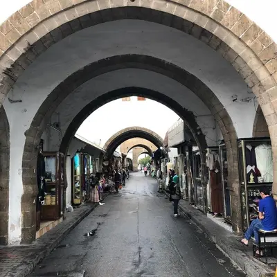 an alley way in a market with people walking through it at 3BR Authentic Apartment in the heart of Casablanca in Casablanca