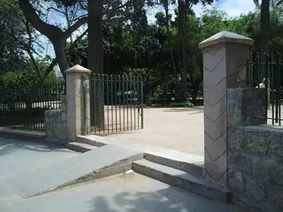 a wrought iron gate with steps next to a fence at 3BR Authentic Apartment in the heart of Casablanca in Casablanca