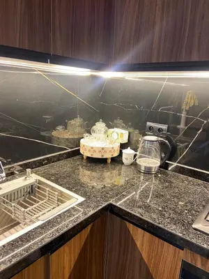 a kitchen with a counter with a sink and a stove at Le Miroir in Casablanca