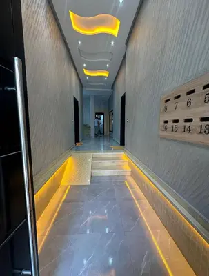 a hallway in a building with lights on the ceiling at Nice apartment in temara-a in Temara