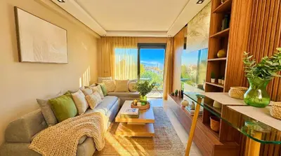 a living room with a couch and a table at Maya Suites - Habous Old Town - Panoramic City View in Casablanca