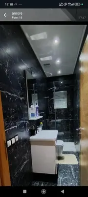 a bathroom with a sink and a toilet at Temara wifak in Temara