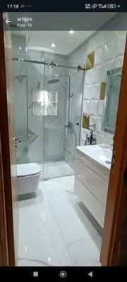 a bathroom with a shower and a toilet and a sink at Temara wifak in Temara