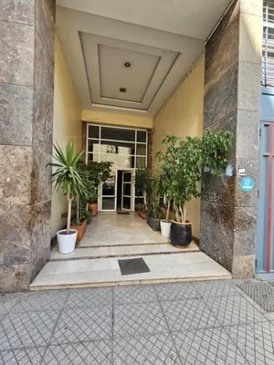 a hallway with potted plants in a building at Casablanca Comfortable City-Centre Apartment in Casablanca