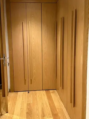 a room with two closet doors and a wooden floor at Marina de Casablanca in Casablanca