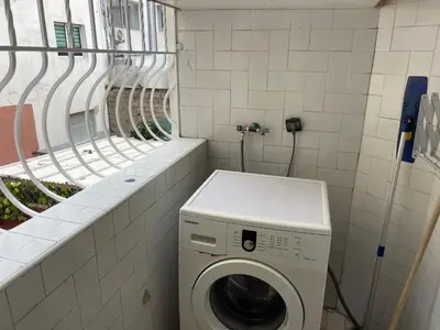 a washing machine in a bathroom with a window at Casablanca Apartments & B&Bs in Casablanca