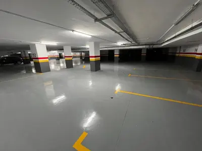 an empty parking garage with yellow and black columns at Le studio Chic in Casablanca