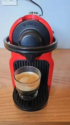 a coffee maker on a table with a cup of coffee at Le studio Chic in Casablanca