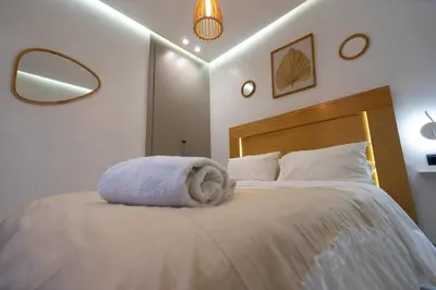 a bedroom with a bed with a towel on it at Luxury Studio near to H2M Area in Casablanca