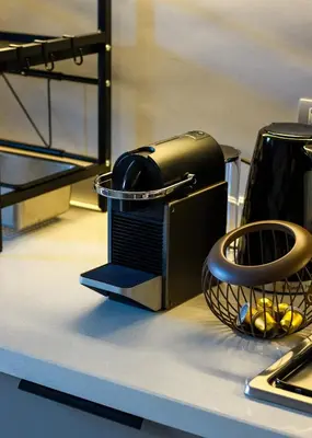 a toaster sitting on top of a counter at Elegance - 2 bedrooms with Pool - 5 min Airport in Nouaseur