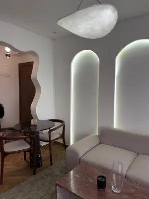 a living room with a couch and a table at Luxurious studio with Jacuzzi in Casablanca in Casablanca