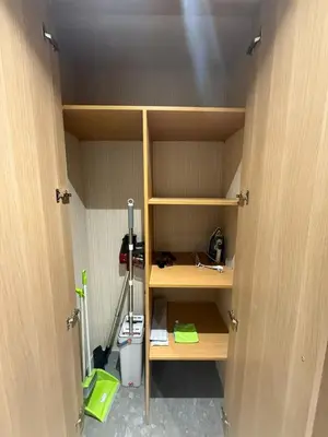 a room with wooden shelves and a room with a broom at Studio luxe Centre ville in Casablanca