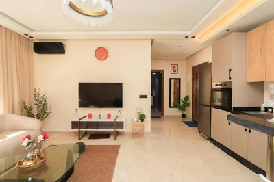 a living room with a couch and a tv at New and bright stylish studio in Casablanca