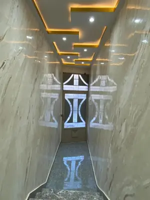 a hallway with a door and a reflection in the water at Sunny Cozy House Close to the Beach in Bouznika