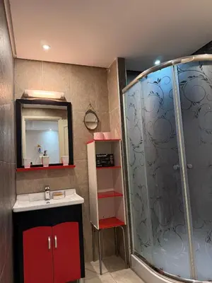 a bathroom with a red sink and a shower at Agdal Central Spacious 2BR with Terrace in Rabat