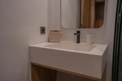 a bathroom with a white sink and a mirror at AnfaSuites - Résidence Pashmina - Maarif - Parking in Maarif