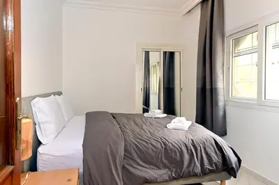 a bedroom with a bed and a window at Appartement chic de 2 chambres au coeur de casablanca in Casablanca