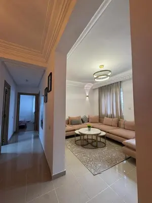 a living room with a couch and a table at Opposite Train Station & Tram Modern Quiet & Meals Available in Casablanca
