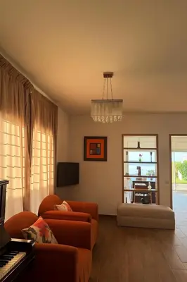 a living room with a couch and a piano at Villa front mer in Rabat