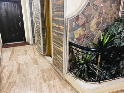 aoyer with a plant in a planter next to a door at 2 bedroom apartment with breakfast included in Casablanca