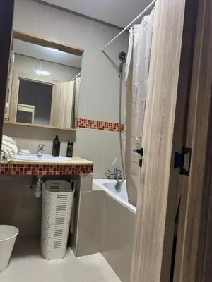 a bathroom with a sink and a shower and a toilet at Opposite Train Station & Tram Modern, Quiet & Meals Available in Casablanca