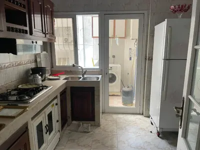 a kitchen with a sink and a refrigerator at Casablanca Happy Homestay in Casablanca