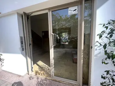 an entrance to a building with a sliding glass door at Beautiful 3 Bedroom in Heart of Hay Riad in Rabat