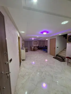 a living room with purple lights on the ceiling at Saad's villa in Mohammedia