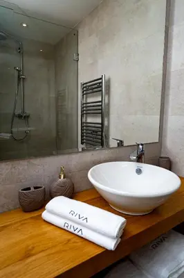 a bathroom with a white sink and a mirror at Appartement cosy & chic Triangle d'or in Casablanca
