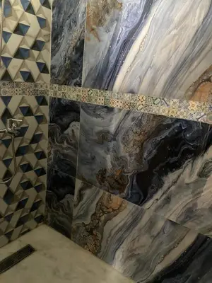 a bathroom with a marble floor with a measuring tape at pretty apparently in Casablanca