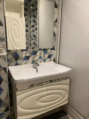 a bathroom with a white sink and a mirror at pretty apparently in Casablanca