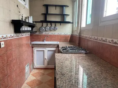 a kitchen with a stove and a sink in it at pretty apparently in Casablanca