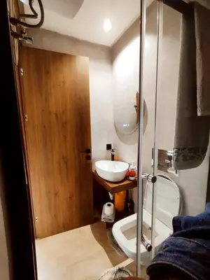 a small bathroom with a sink and a shower at New Cozy Studio In the Cornish of Casablanca in Casablanca