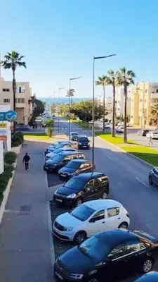 a row of cars parked in a parking lot at appartement prés de corniche de rabat in Rabat