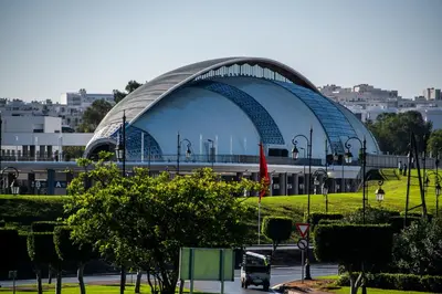 a large building with a domed roof in a city at appartement prés de corniche de rabat in Rabat